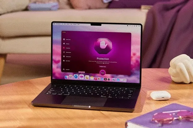CleanMyMac app interface showing the protection and malware scanning module open on a MacBook screen.